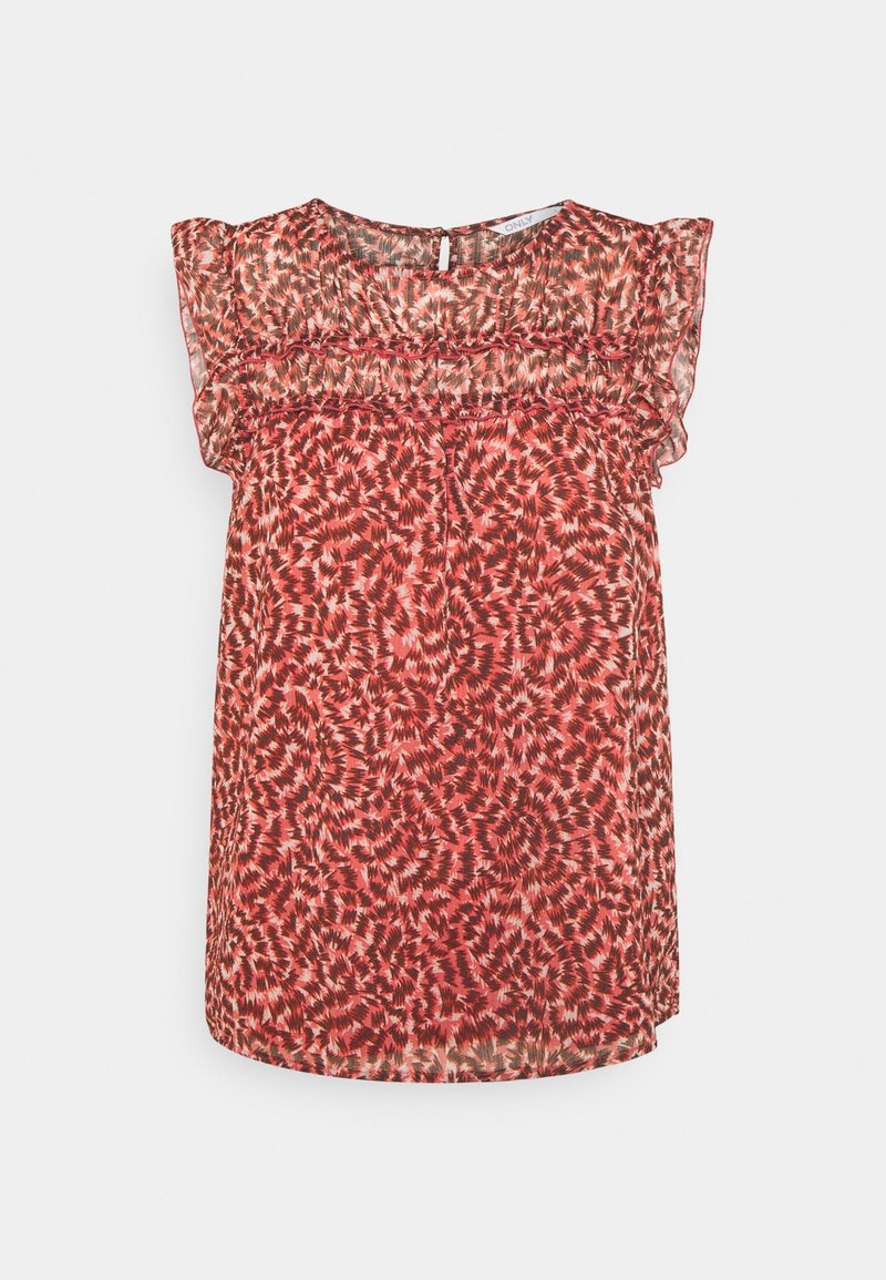 Blouse sans manches à motifs abstraits rouges et roses, avec épaules transparentes à volants et encolure ronde avec petite fermeture par bouton au dos.