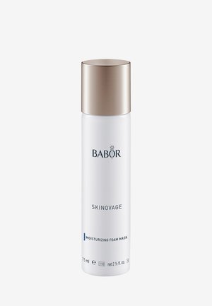 Masque mousse hydratant dans un flacon cylindrique blanc, avec un élégant capuchon doré métallique. Présente le logo de la marque et les détails du produit en texte bleu.