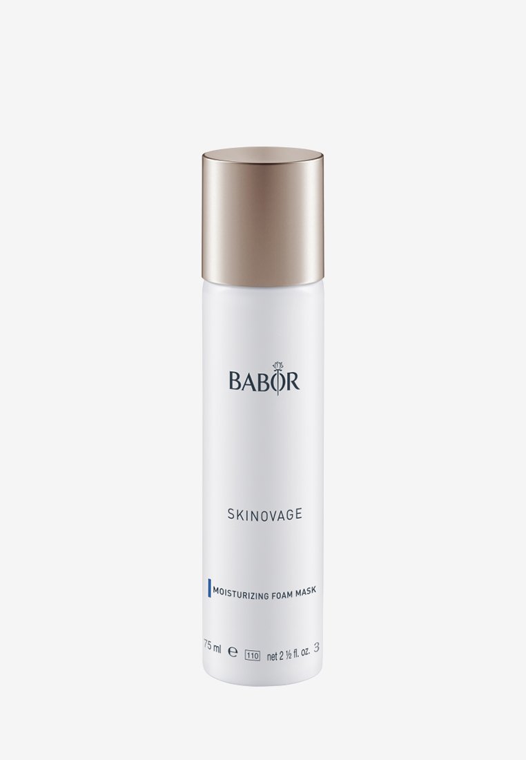 Masque mousse hydratant dans un flacon cylindrique blanc, avec un élégant capuchon doré métallique. Présente le logo de la marque et les détails du produit en texte bleu.