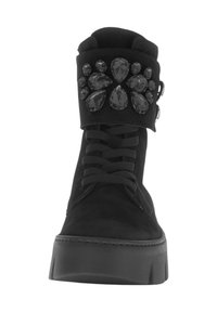 Black suede ankle boots with a flat sole, featuring a decorative cuff adorned with black gem accents in various shapes.