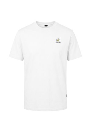 T-shirt blanc à manches courtes avec un petit motif d'œuf au plat et le texte "eggstra smile" sur la poitrine gauche.