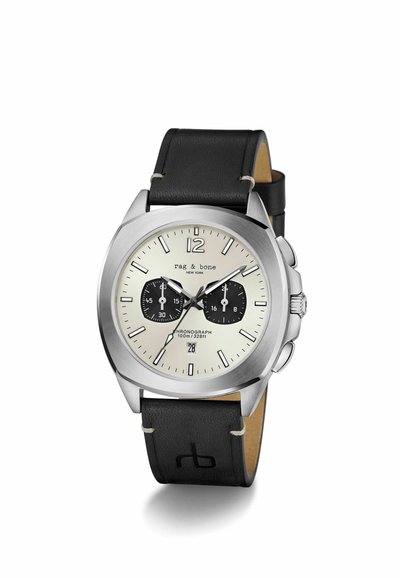 Hronogrāfs no nerūsējoša tērauda ar krēmkrāsas ciparnīcu, melniem apakšciparnīcām, sudrabota toņa indeksiem un melnu ādas siksniņu. Ūdensizturība: 100m.