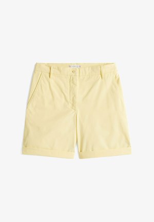 Shorts di cotone gialli con parte frontale piatta, due tasche laterali, risvolti e chiusura con bottone in vita.