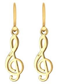 Boucles d'oreilles dorées en forme de clés de sol, présentant des courbes lisses et une surface polie. Chaque boucle d'oreille est dotée d'une attache à crochet.