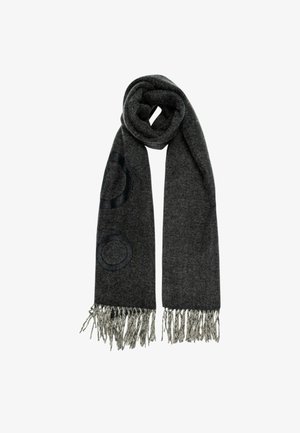 Sciarpa grigia intrecciata con bordi frangiati, caratterizzata da una texture liscia e un motivo circolare in una tonalità più scura. Realizzata in materiale morbido e caldo.