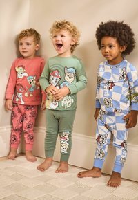 Three children wear colorful pajamas with cartoon characters. Fabrics include solid and patterned designs in pink, green, and blue.