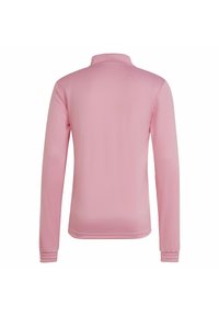 Långärmad rosa tröja med ståkrage och texturerade manschetter. Slät tyg med en strukturerad passform, inga synliga logotyper eller mönster.