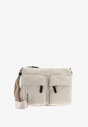 Sac bandoulière en velours côtelé beige avec deux poches avant, zip et accents noirs, et une sangle beige réglable. Texture douce et forme rectangulaire.