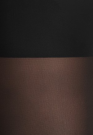 Schwarze und braune, strukturierte Strumpfhosen mit einem glatten oberen Abschnitt und einem gewebten Muster im unteren Bereich, das einen Farbverlauf zeigt.