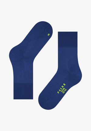 Marineblaue Baumwollsocken mit gerippten Knöchelbündchen. Sie verfügen über eine glatte Textur und helle grüne aufgedruckte Buchstaben zur Größen- und Markenidentifikation.