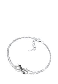 Silverfärgad armbandskedja med ett dubbelkedjadesign och en oändlighetssymbol prydd med svarta stenar. Justerbar låsning för storlek.