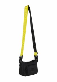 Sac bandoulière noir DKNY avec poche zippée avant et large bandoulière jaune et noire, marqué des logos DKNY.