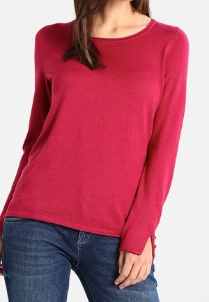 Pullover a maniche lunghe fucsia in maglia con scollatura rotonda, caratterizzato da bottoni decorativi sui polsini e una finitura morbida e testurizzata.