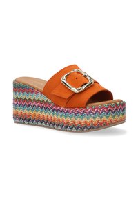 Orange suede wedge sandals with a large silver buckle. The multicolored woven platform features zigzag patterns in various shades.