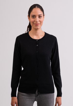 Schwarze Strickjacke aus weichem Material, mit rundem Halsausschnitt, langen Ärmeln und einer Knopfleiste auf der Vorderseite. Strukturiertes Finish.