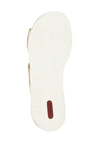 White rubber shoe sole with zigzag tread pattern and a red "rieker" logo. Textured finish with smooth borders.