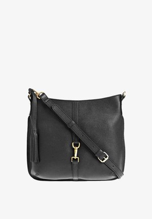 Sac en cuir noir texturé à bandoulière ajustable, matériel doré, et pampille décorative sur le côté.