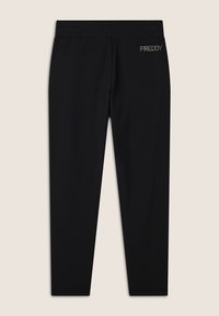 Leggings noirs ajustés en tissu doux, dotés d'une taille élastique et d'un petit logo argenté "FREDDY" sur le haut du dos.