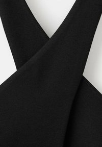 Black fabric with a smooth texture, featuring a crisscross design. The material appears stretchy, suitable for clothing construction.