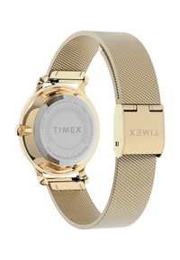 Gold-tone metal watch with a mesh band and a round case. The back features a silver stainless steel finish and brand engraving.