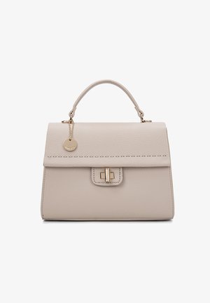 Structured handbag in light beige textured leather with a top handle, gold hardware, front flap, and a decorative charm attached.