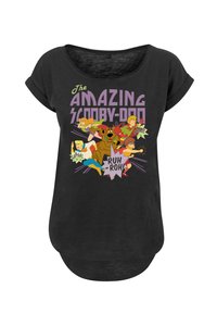 Black T-shirt featuring a colorful cartoon graphic of Scooby-Doo and other characters with the text "The Amazing Scooby-Doo" and various action words.