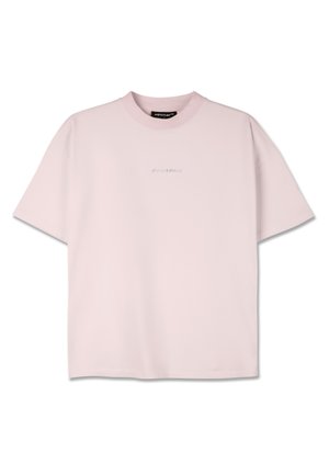 Light pink t-shirt made of soft cotton. Features a round neckline, short sleeves, and a subtle brand logo on the chest.