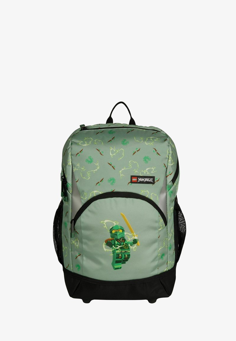 Green LEGO Ninjago backpack with ninja character holding a sword, patterned with weapons and symbols, black base and mesh side pockets.
