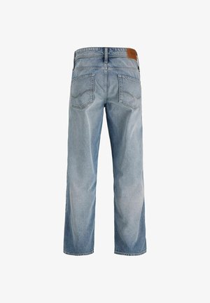 Hele sinised teksapüksid sirge säärega, millel on kaks tagataskut tikanditega ja pruun nahast detail vöökohal.