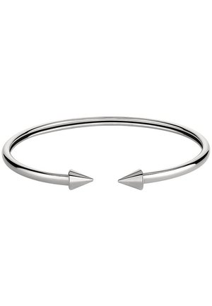 Bracelet ouvert en argent avec deux extrémités coniques pointues, finition métallique lisse et polie, design minimaliste de bijou.