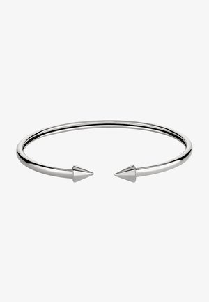 Bracelet ouvert en argent avec deux extrémités coniques pointues, finition métallique lisse et polie, design minimaliste de bijou.