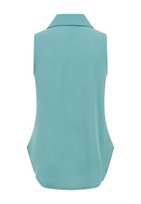 Blouse sans manches vert sarcelle clair avec col, tissu texturé et légère courbe à l'ourlet, vue de dos.