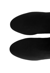 Black ankle boots with a smooth, matte texture and pointed toe design. The soles appear narrow, showcasing a sleek silhouette.