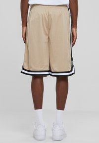 Urban Classics STRIPES  - Jogginghose - unionbeige black white