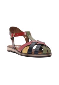Colorful leather sandals featuring multiple interwoven straps in red, green, yellow, and navy, with a low heel and adjustable ankle strap.