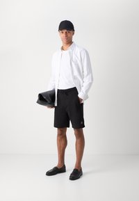 HUGO Pantalon de survêtement - black