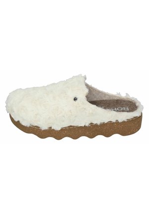 Furry white slip-on clog with a textured upper, cork-like midsole, and a scalloped edge. Soft interior lining for comfort.