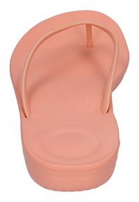 Pinkfarbene Gummiflip-Flops mit glatter Oberfläche und strukturiertem Fußbett. Sie verfügen über ein klassisches Zehentrenner-Design für einfaches Anziehen und Komfort.