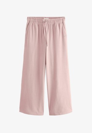 Lichtroze, wijde sweatpants met een elastische tailleband met trekkoord en zijzakken. Zachte textuur met een gladde afwerking.