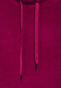 Felpa fucsia con texture a costine, caratterizzata da spesse coulisse in tonalità abbinata, che terminano con punte in metallo nero.