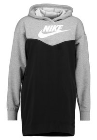 Nike hoodie featuring a grey upper section and black lower section, with a prominent white logo, soft fabric, and ribbed cuffs.
