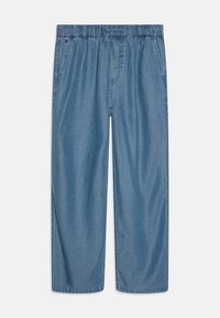 Heledsinine, laiad püksid, mis on valmistatud denimpaarist. Omavad elastset vööd, millel on nöör ja küljetaskud.