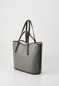 Gray tote bag with a geometric pattern, black leather handles, and a pink interior. Offers a structured shape and smooth texture.