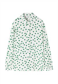 Camicia verde a pois su uno sfondo bianco, con chiusura a bottoni frontale, colletto e maniche lunghe con polsini abbottonati.