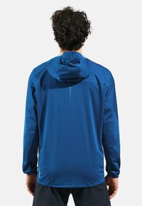 Blue lightweight jacket with a hood, featuring a smooth texture, long sleeves, and a vertical reflective detail on the back.