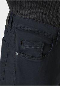 Dark blue pants featuring a textured fabric, a traditional pocket on the front, and a visible stitching detail along the edges.
