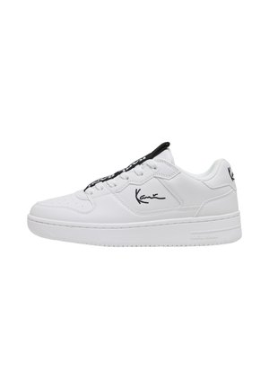 White low-top sneaker with black interior lining, black brand logo on side and heel, and white laces.