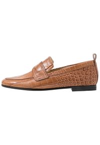 Brown leather loafers with a crocodile texture, featuring a slip-on design and a flat sole. Notable strap across the upper for added detail.