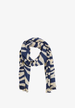 Écharpe bleu marine et crème en tissu doux présentant un motif géométrique avec des bords frangés, pliée et drapée en boucle.