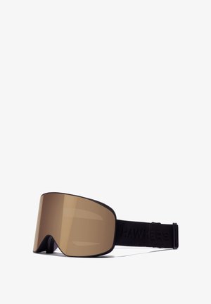 Rudos atspalvio dideli slidinėjimo akiniai su juoda elastine juosta, ant kurios išgraviruotas "HAWKERS". Lęšis turi lygų, atspindintį paviršių.